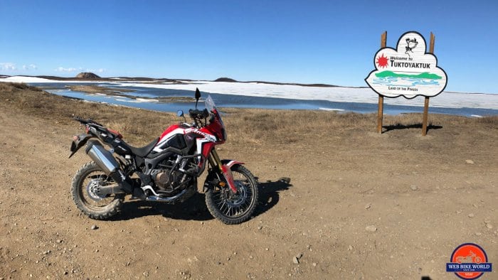 My 2017 Honda Africa Twin Next to the Tuktoyaktuk Entrance Sign