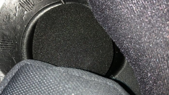 Helmet pads reinserted over wires with speaker exposed