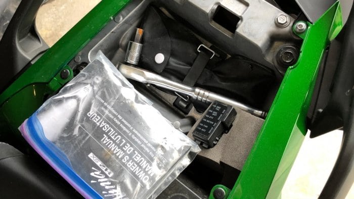 2018 Kawasaki Ninja H2SXSE tool storage compartment.