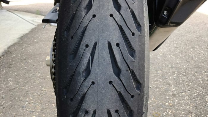 A photo of a brand new Michelin Road 5 rear tire after installation on the Ninja H2SX SE.