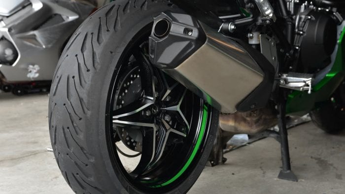 A Michelin Road 5 rear tire installed on a Ninja H2SX SE.