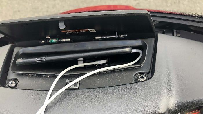 Indian Chieftain Ltd cell phone storage compartment with an iPhone 8 in it.