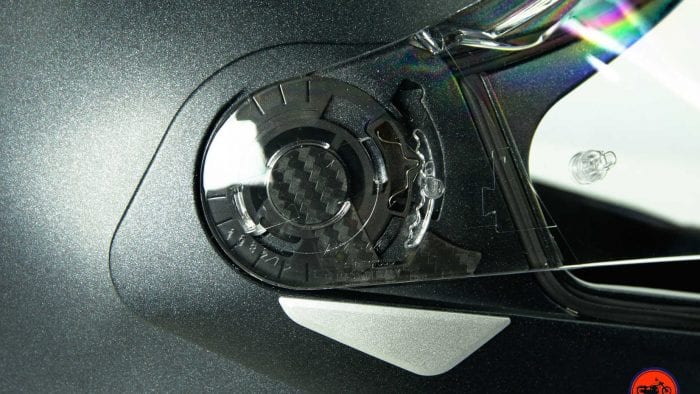 Visor pivot on the Nolan N100-5 helmet with N-Com B901L installed.