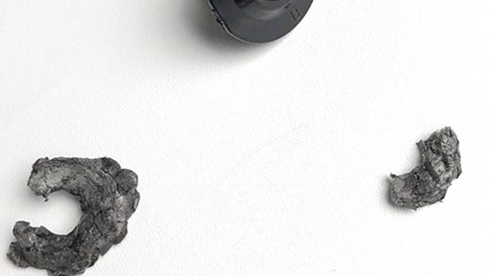 Cheekpad anchor that pulled out of the Nolan N100-5 helmet with N-Com B901L installed.