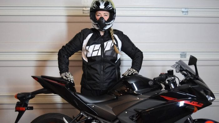 ICON Women’s Automag 2 Jacket worn by Brittany next to her motorcycle