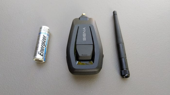 SENA +Mesh Adapter shown with AA battery for scale