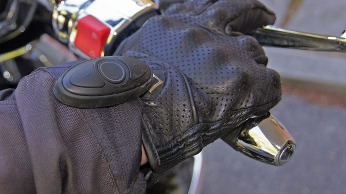 Sena SC1M remote attached to moto glove