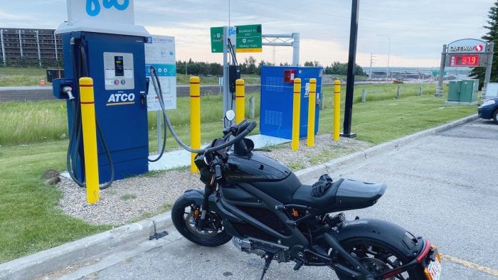The Harley Davidson LiveWire charging at a fast charge station.