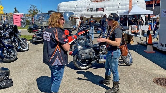 People enjoying the festivities of the Rally in the Rockies held at Calgary Harley Davidson.