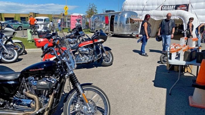 Motorcycles parked at the Calgary Harley Davidson parking lot.