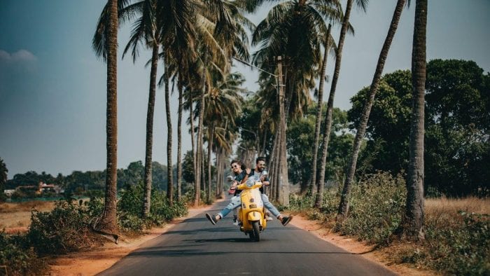 couple riding a scooter