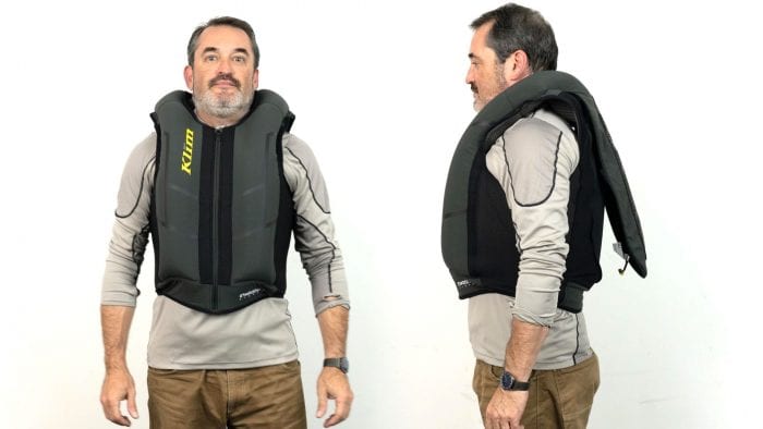 Front and side view of user wearing inflated Klim Ai-1 airbag vest