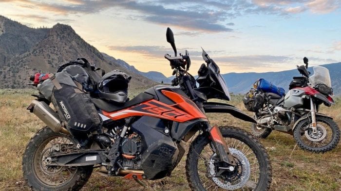 The Mosko Moto Reckless 80L V3.0 on a KTM 790 Adventure with a BMW R1200GS in the background.