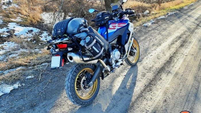 A 2020 BMW F850GS Adventure parked on a country road with the Mosko Moto Reckless 80L v3.0 Revolver luggage installed.