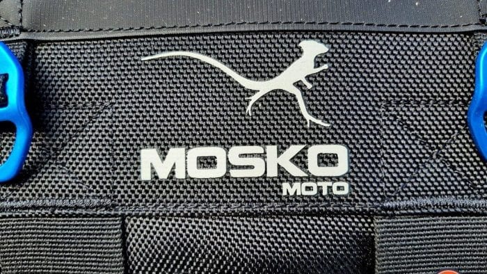 The Mosko Moto logo of a Basilisk lizard on some of their luggage.