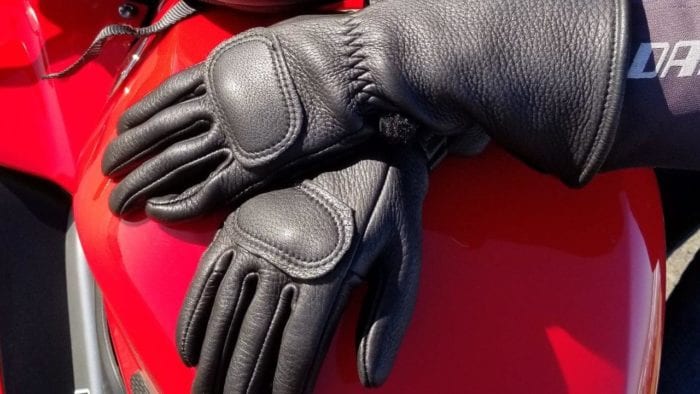 The Lee Parks Design Deersports gloves sitting on a Honda VFR800 gas tank.