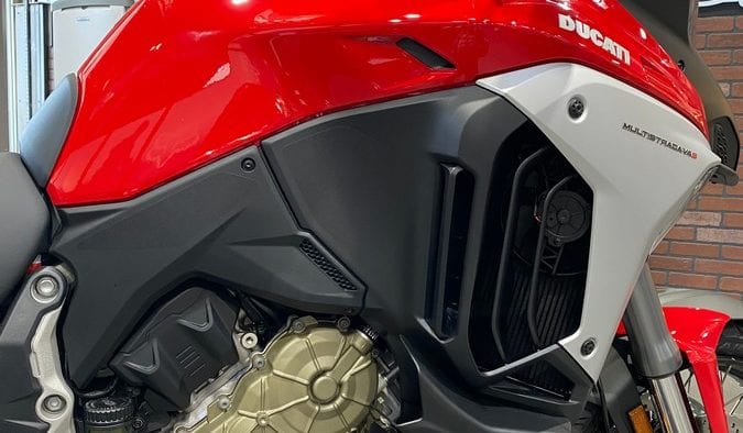 Vents and scoops are built into the Multistrada V4S to keep hot air away from the rider while directing flow past the rider to curb turbulence.