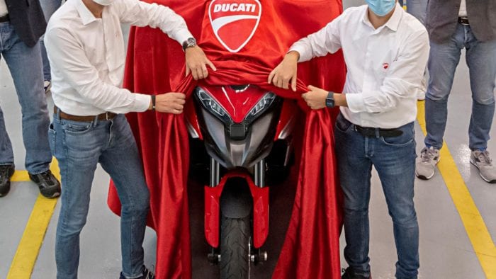 a pair of men revealing the Ducati Multistrada V4 S