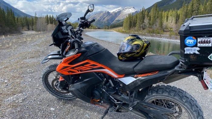 The Shark Spartan GT helmet sitting on the seat of a KTM 790 Adventure in the Canadian Rockies near Canmore, Alberta.