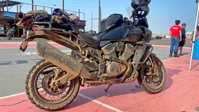 A Harley Davidson Pan America covered in mud.