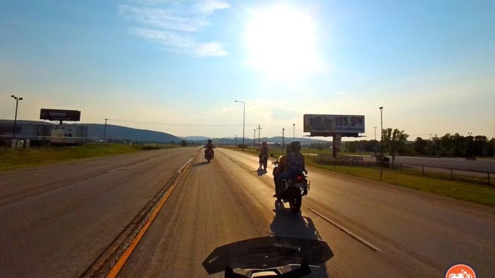 Riding motorcycles near Sturgis, SD at sunset.