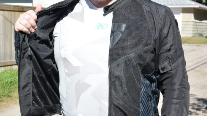 A front view of the Arc Air Mesh jacket, unzipped to show airflow zones