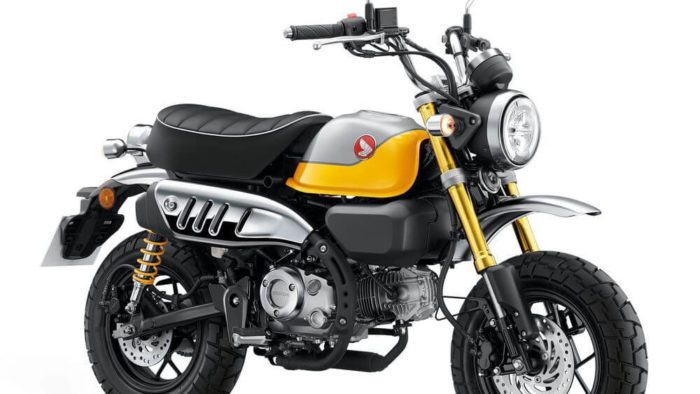 A side view of the 2022 Honda Monkey in Banana Yellow