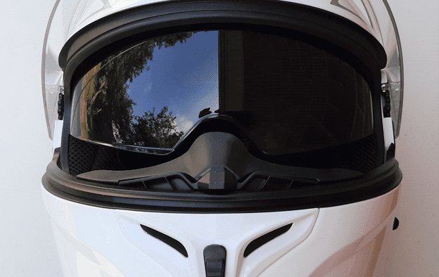 A view of the white Outrush R Modular Helmet, with the sunglasses option flipped down