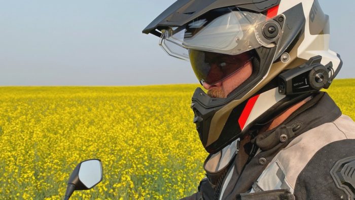 Me wearing the BMW GS Pure helmet in front of a canola field.
