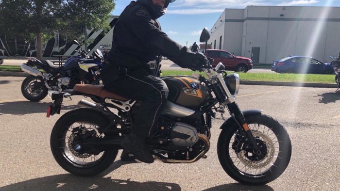 A side view of Simon Bertram on the 2021 BMW R NineT Scrambler