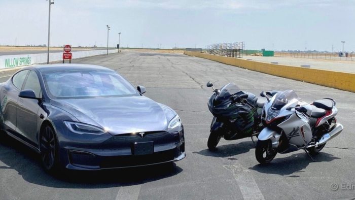 A view of a Tesla Model S Plaid, a 2022 Suzuki Hayabusa and a 2021 Kawasaki Ninja ZX-14R ready to race