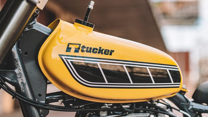 A view of a motorcycle with a Tucker Powersports brand name on the gas tank