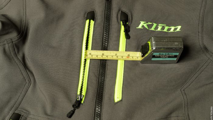 Measuring tape showing 4.75" depth for front zipper pocket