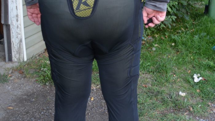 Rear view of rider wearing Kilm tactical base layer pants