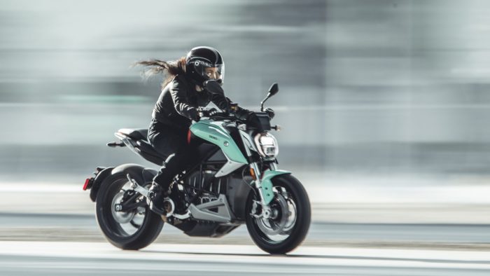 A side view of a model riding a Zero Motorcycle