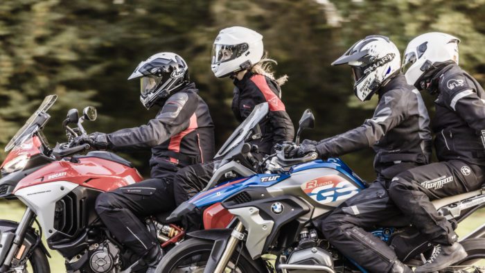 A view of two riders using the new Cardo Systems Bluetooth Communicators