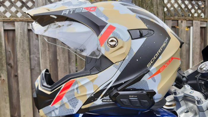 Sena SPIDER RT1 in Scorpion Exo helmet resting on blue bike