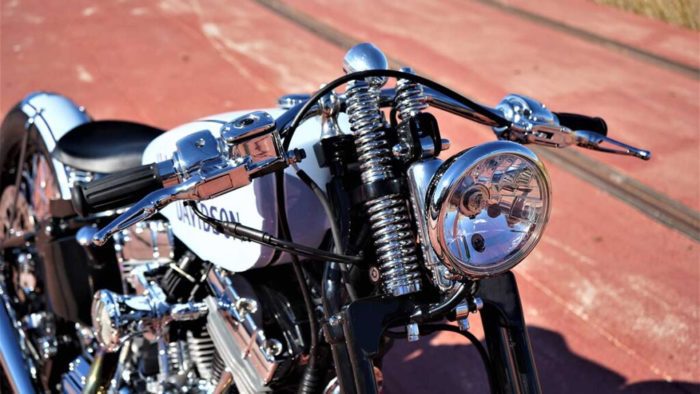 The headlight view from the custom "Springer Bobber Blue" Harley-Davidson Softail Standard Motorcycle from Lord Drake Kustoms
