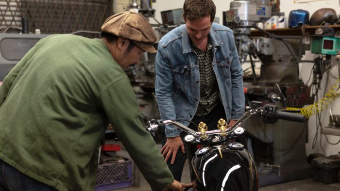 Gō Takamine with Nicolas Hoult next to the new Brat Style bobber from Inaidn Motorcycles that Takamine modded out for the movie star