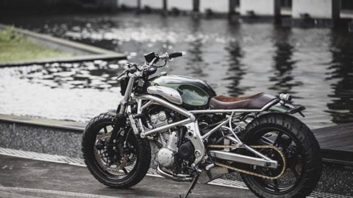 A 2006 Kawasaki ER-6F that's been tricked out with a retro, cafe racer flair