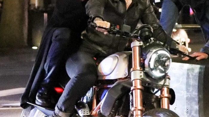 A view of Reeves and Carrie-Anne trying out a Ducati bike for the Matrix