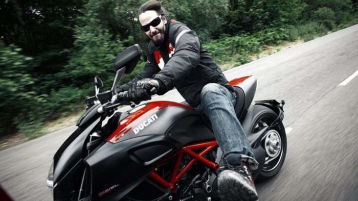 Keanu Reeves with his vehicles