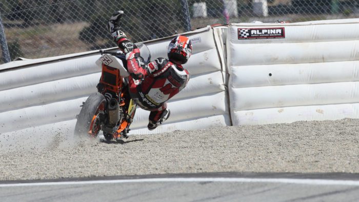 A view of the racers at MotoAmerica using the flimsy soft barriers for motorcycle accidents