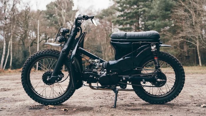 A view of a custom Honda Super Cub that has been customized by Scar's Motorcycles
