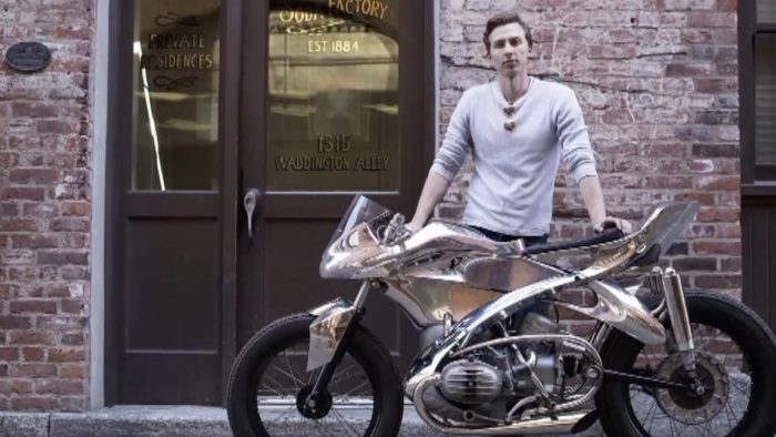 A view of Jay Donovan working on a custom bike for BMW, as per the report from CHEKNews