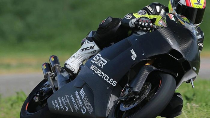 A view of an electric motorcycle in the midst of racing