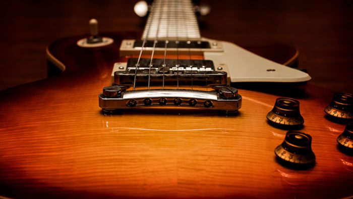 A view of Gibson guitars and triumph adverts in anticipation of an upcoming partnership with Gibson